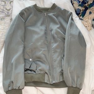 Carli Bybel X Missguided green silk bomber